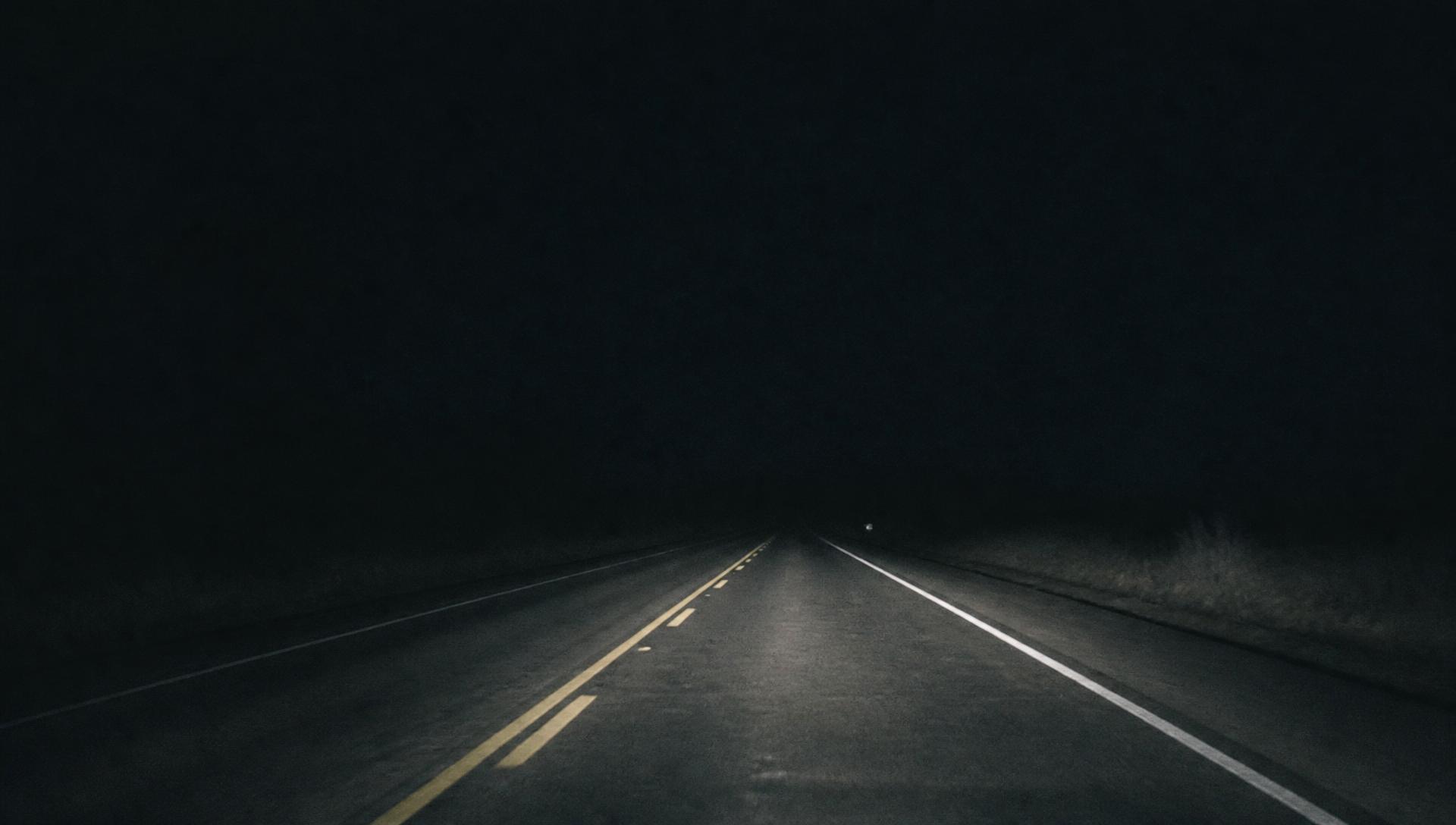 Dark American highway stretching into the night